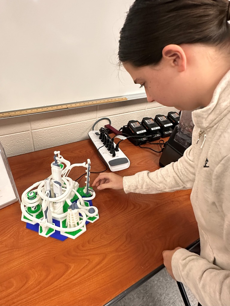 Student with a 3D printed project