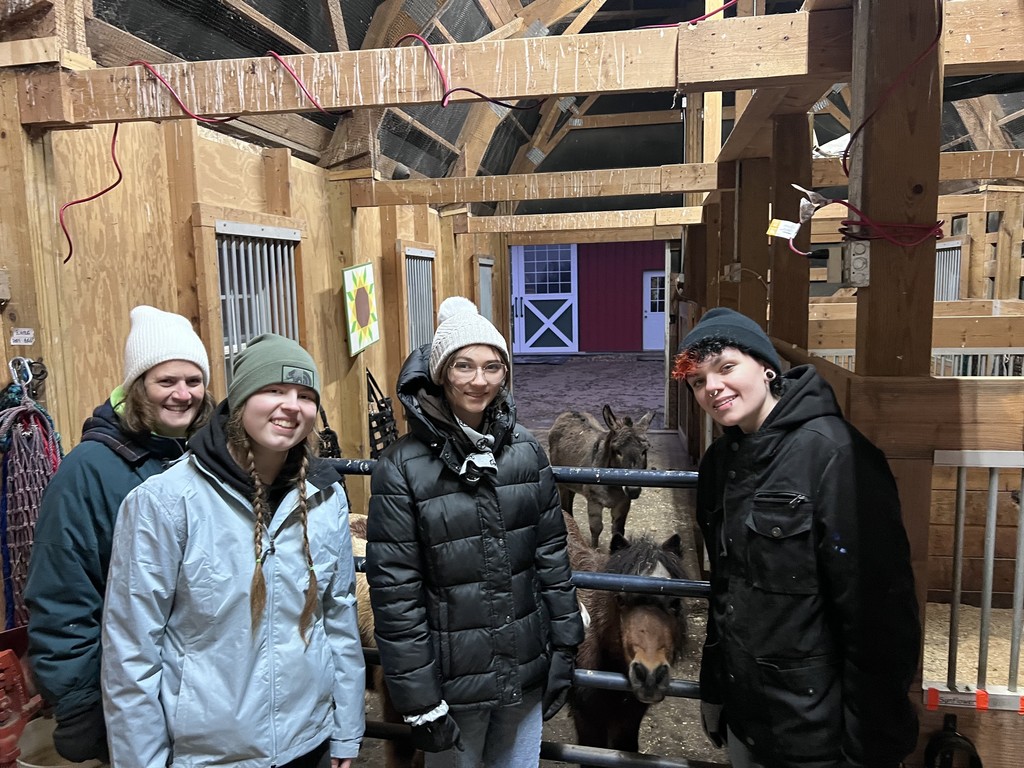 Students volunteering at a farm