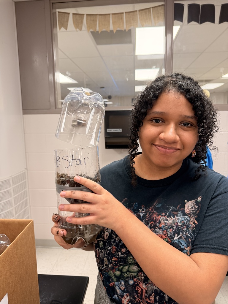 Student planting seeds