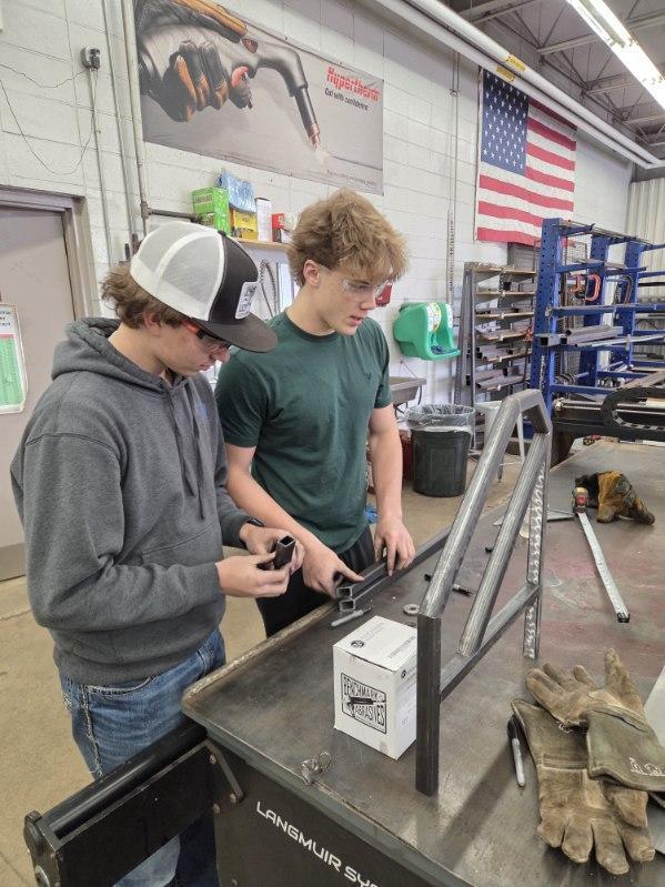 Students working in a shop