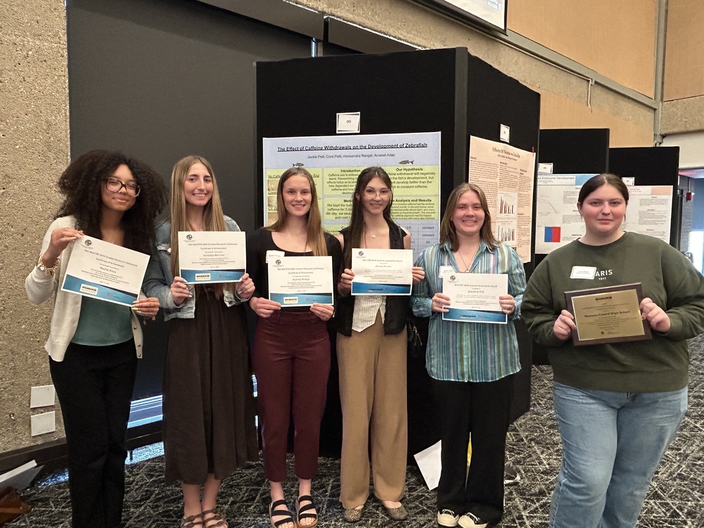 Students holding certificates