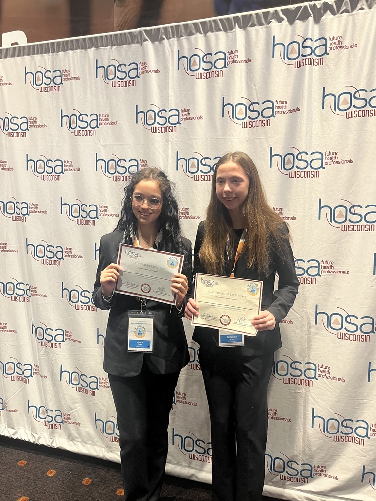 Students holding certificates