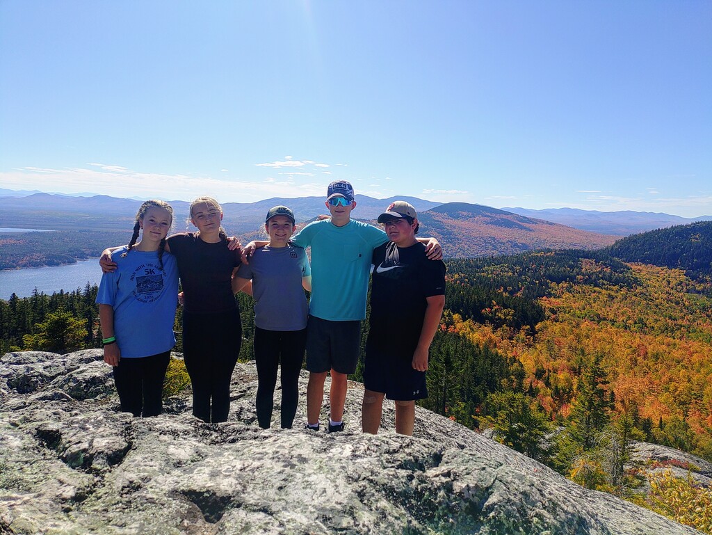 8th grade students on top of sally mountain