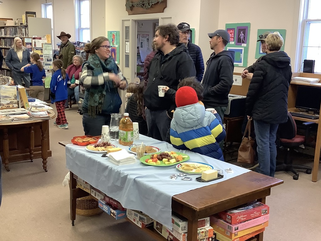 The BCS community enjoying the art show at the Bristol Area Library
