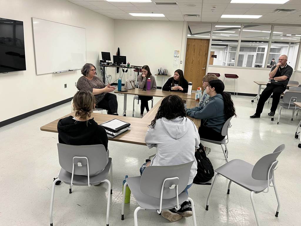 Students speaking with a guest