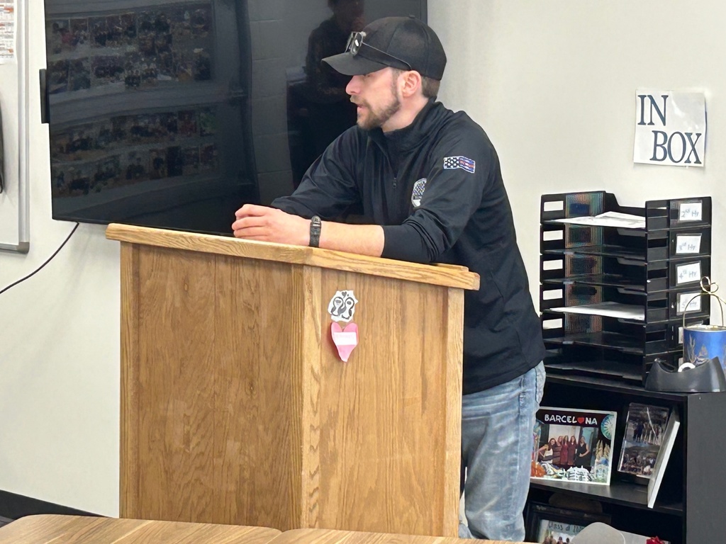 A guest speaker talks to a criminal justice classroom of high school students, this speaker is also a former student