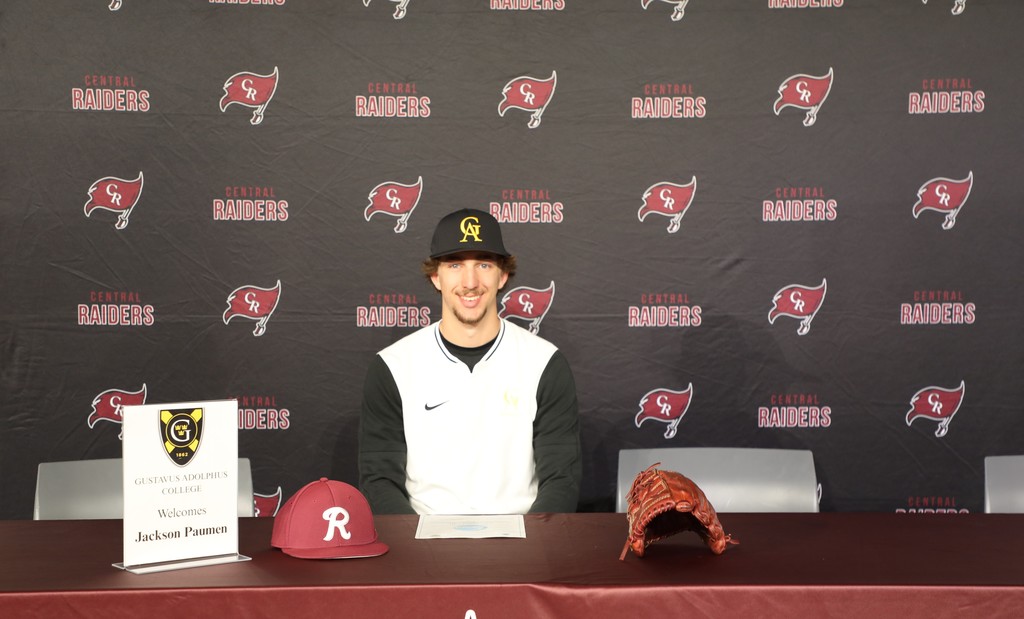 A student signing an athletic scholarship