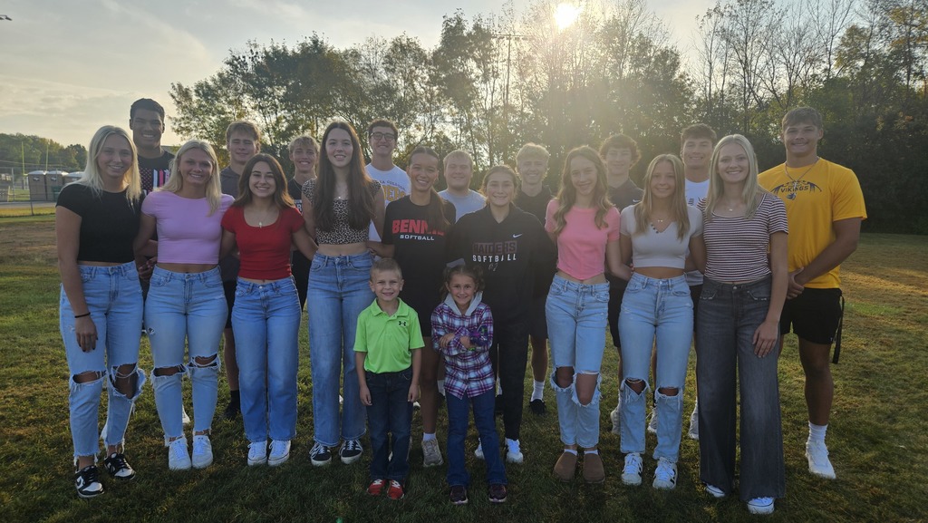 18 high school students and 2 elementary students, posing as the homecoming court
