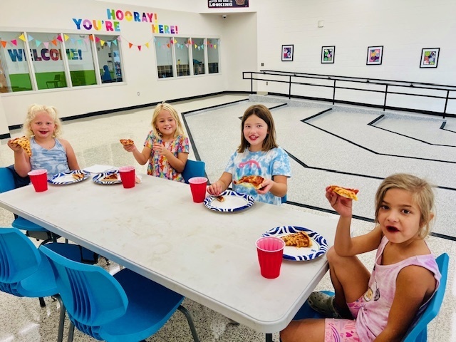 students eating at a pizza party