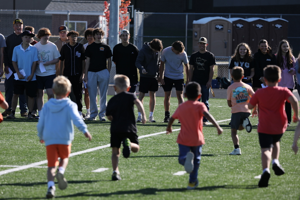 Senior students meeting kindergarteners to exchange school spirit.