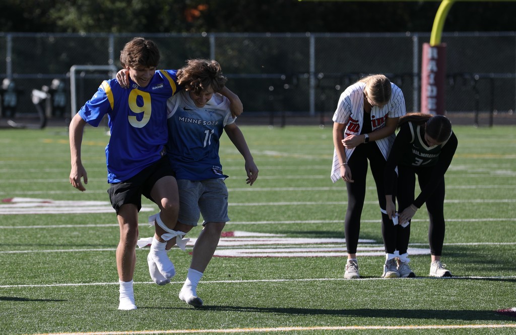 Students participating in a 3 legged race