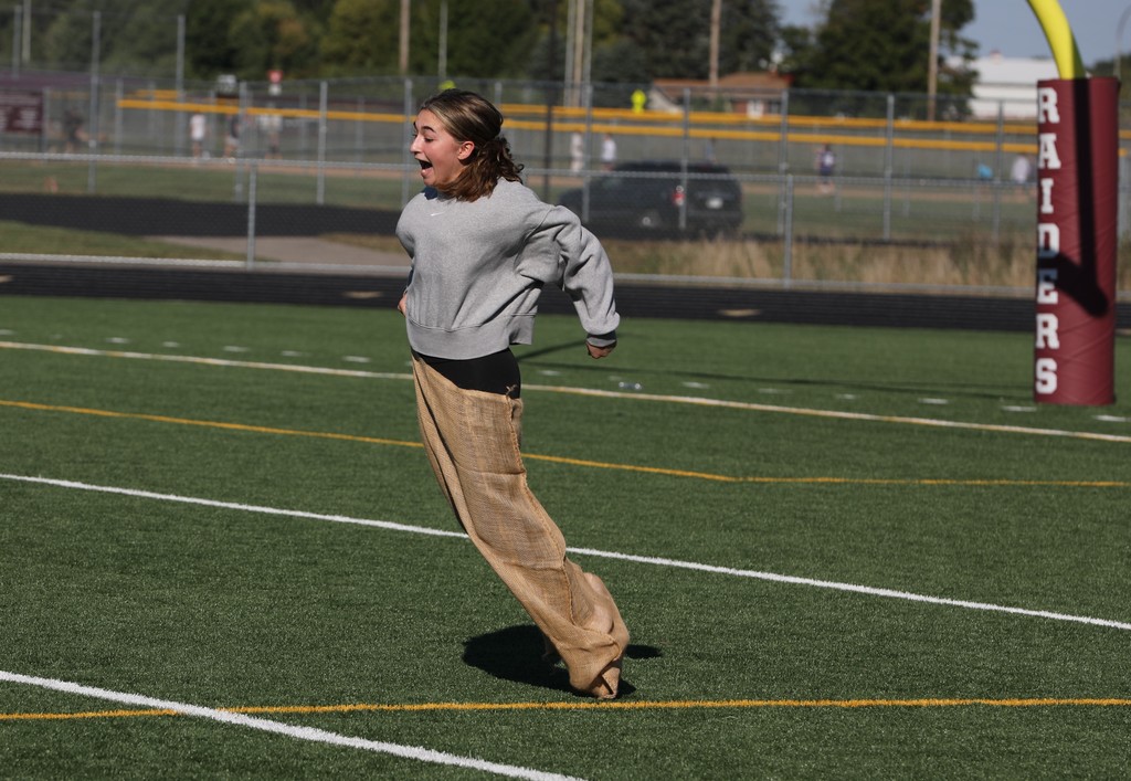 A student participating in a sack race