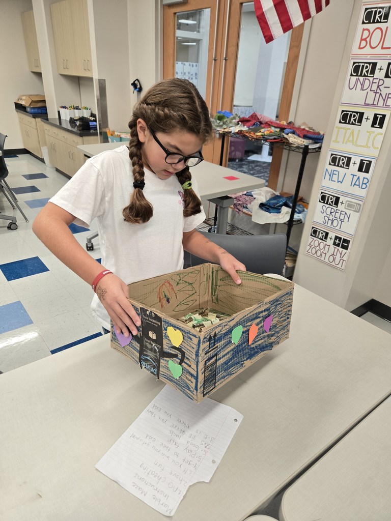 students creating games out of nature materials