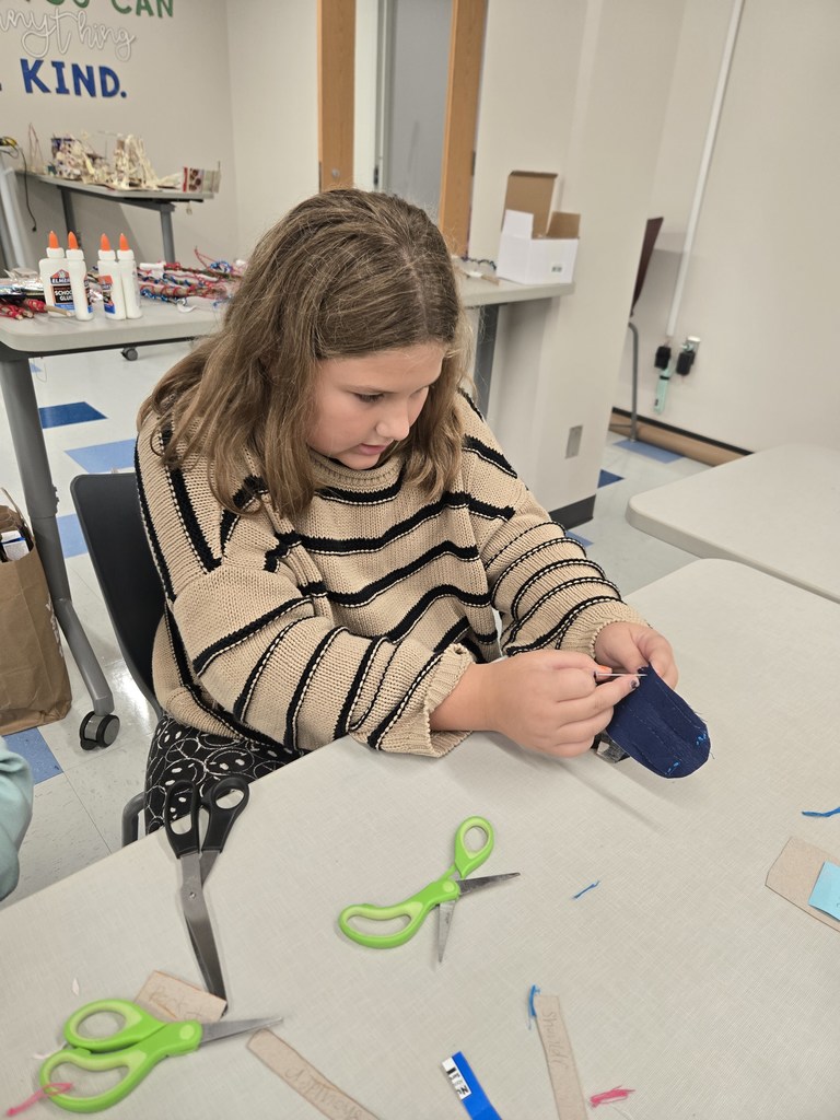 fifth grade students creating model designs of hiking backpacks