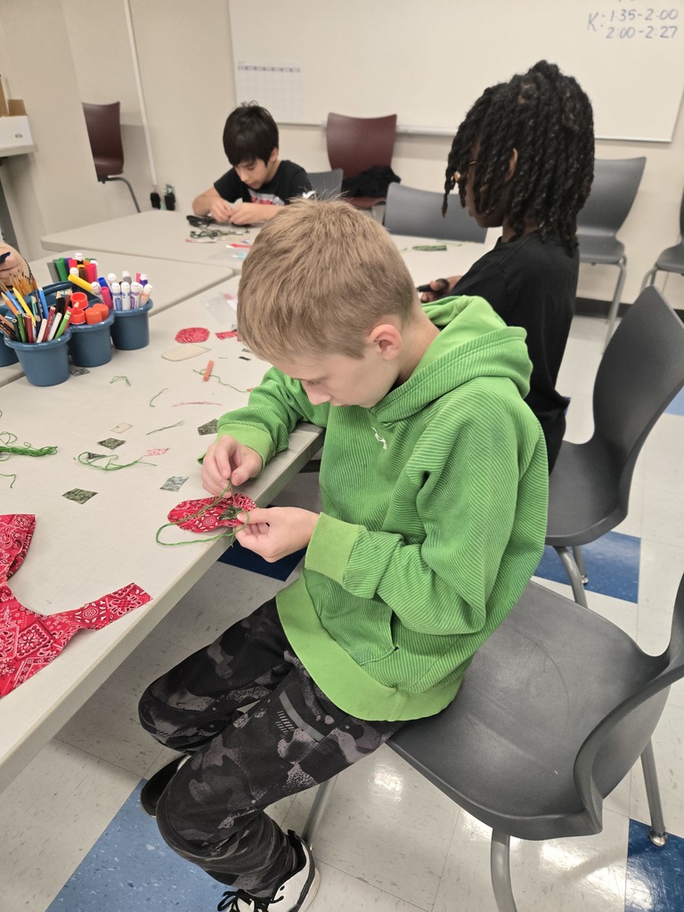 fifth grade students creating model designs of hiking backpacks