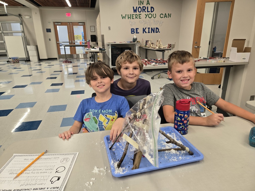 fourth grade students building shelters