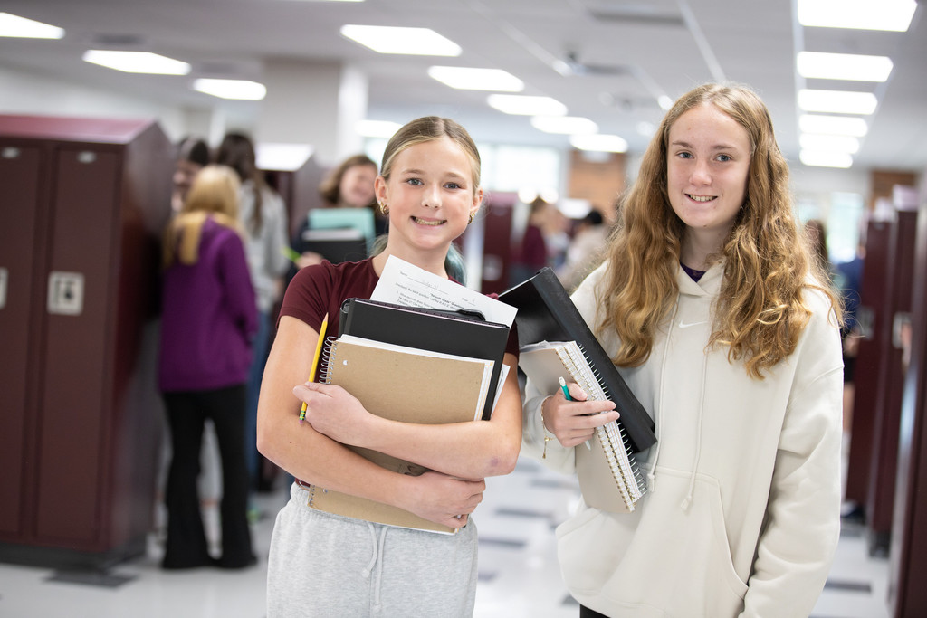 students smiling in hallways