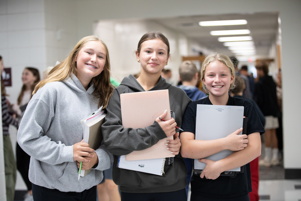 students smiling in hallways