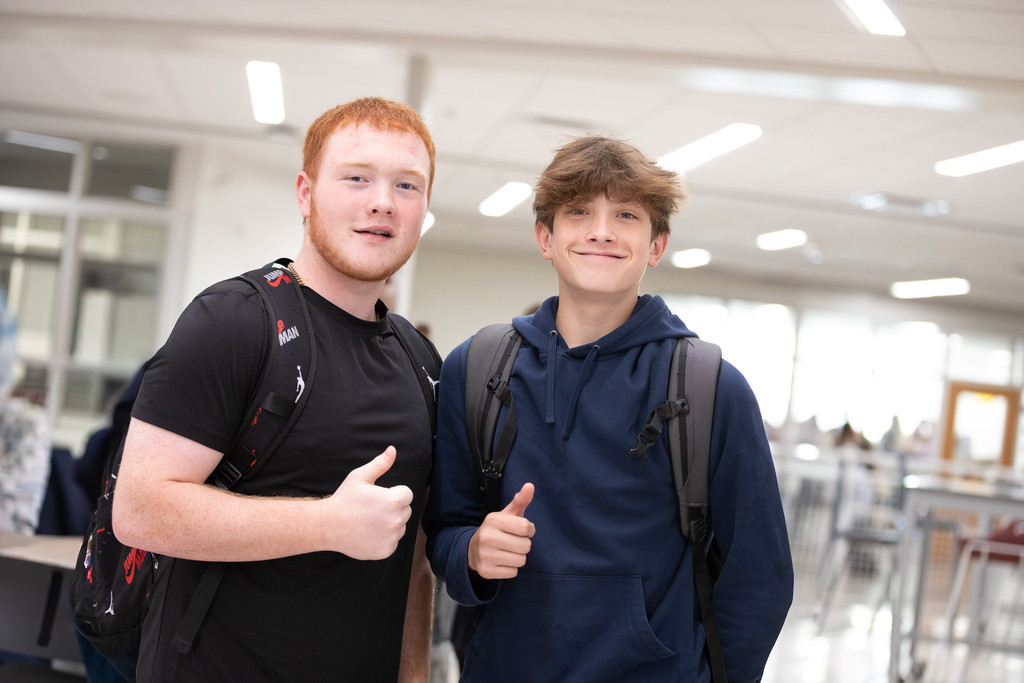 students smiling in hallways
