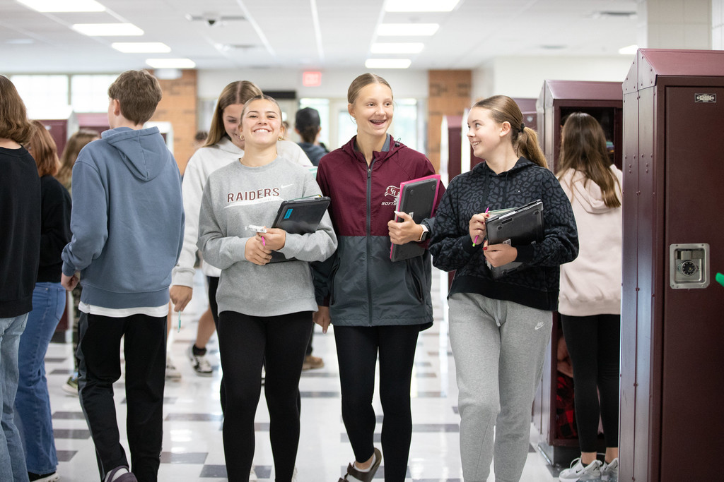 students smiling in hallways