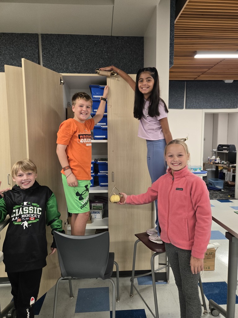 students working on pumpkin stem project
