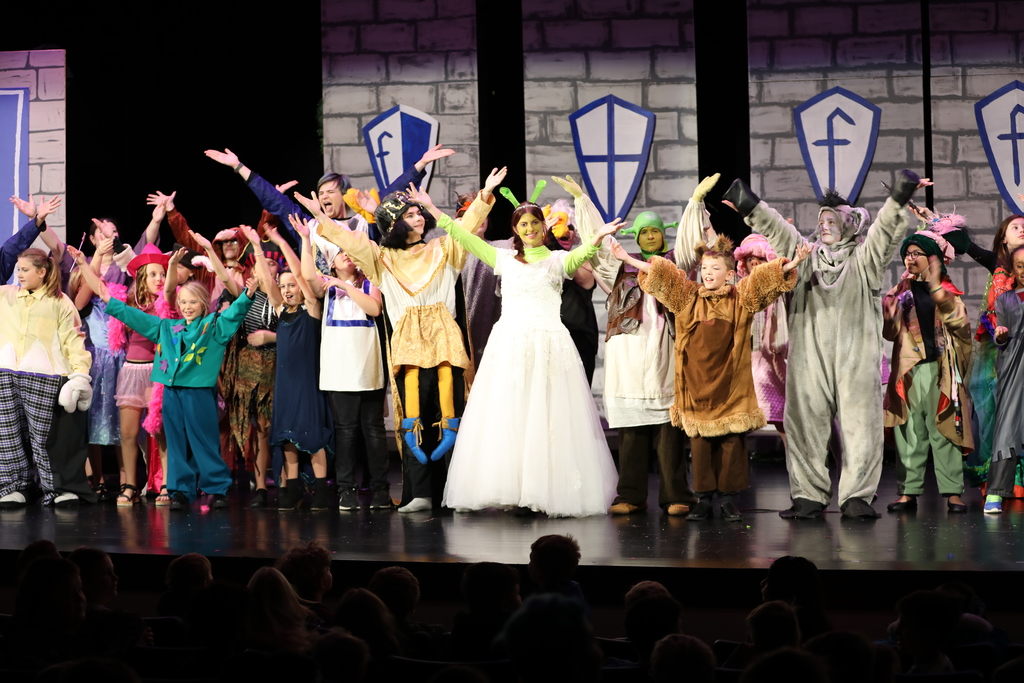 The cast of "Shrek the Musical Jr." on stage. 