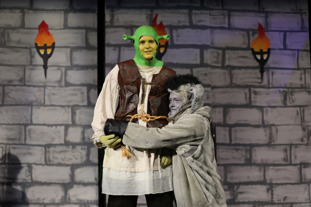 The cast of "Shrek the Musical Jr." on stage. 