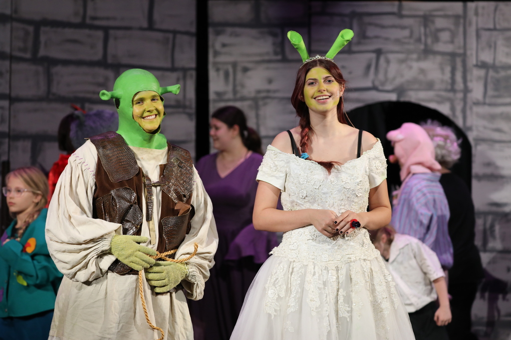 The cast of "Shrek the Musical Jr." on stage. 
