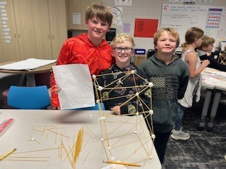 students creating towers with spaghetti and marshmallows