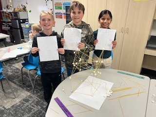 students creating towers with spaghetti and marshmallows