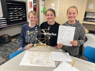 students creating towers with spaghetti and marshmallows