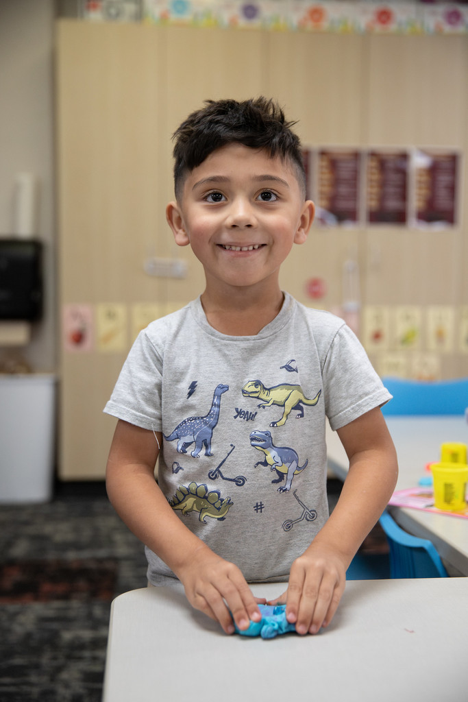 early childhood student working with playdoh