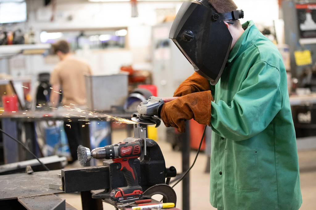 high school student welding