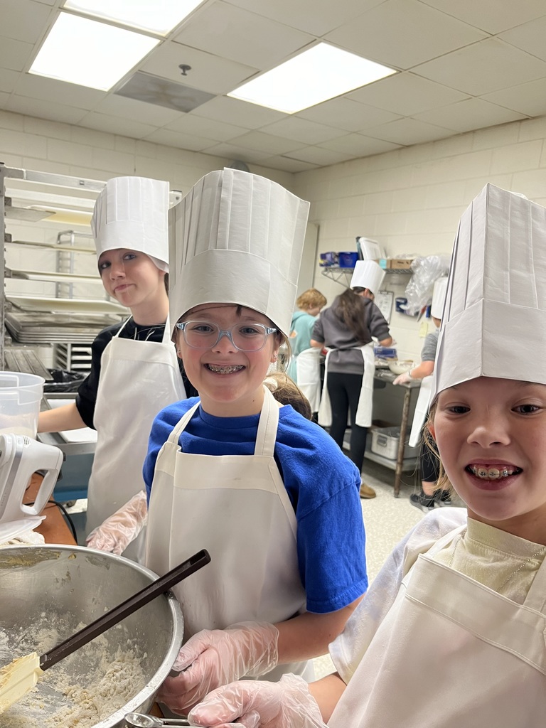 kids baking in aprons and chef hats