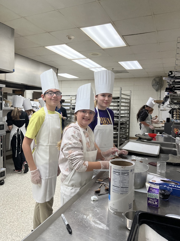 kids baking in aprons and chef hats