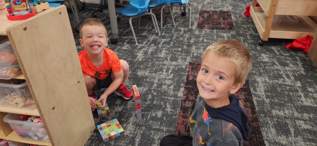 preschool students playing blocks together