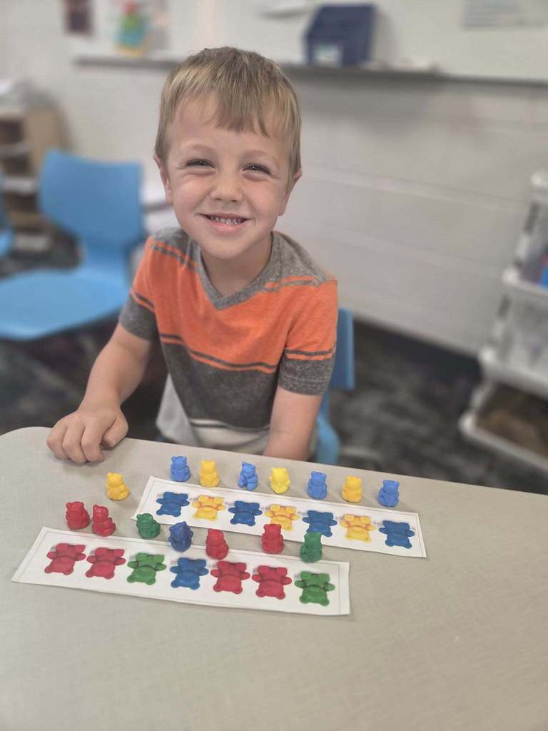 preschool student playing with counters