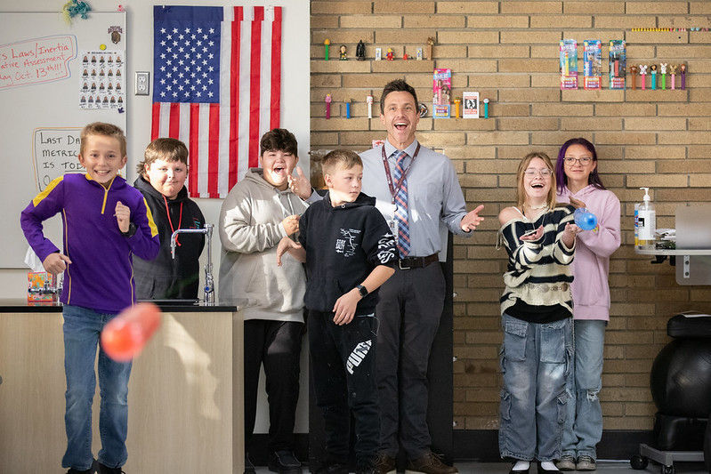 secondary students smiling with principal