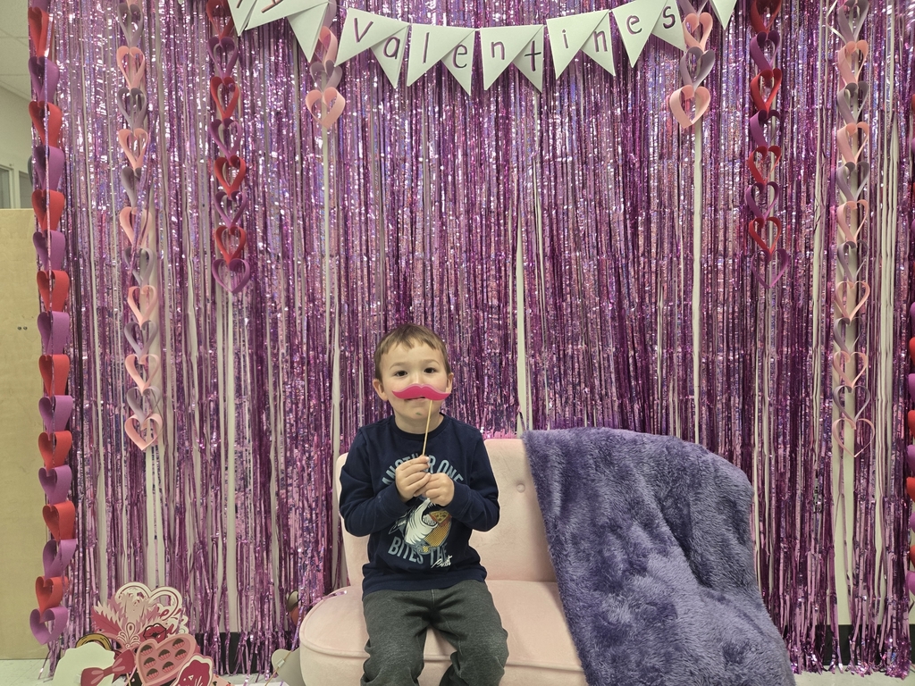 future preschooler in front of valentines sign