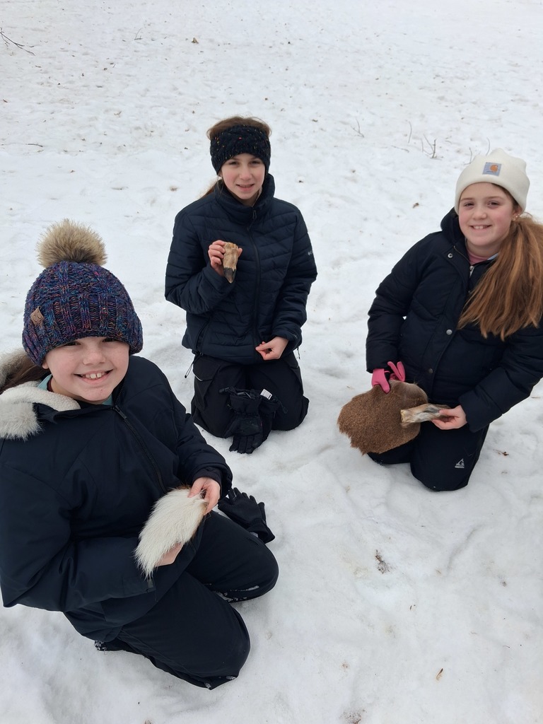 students learning outdoors in the snow