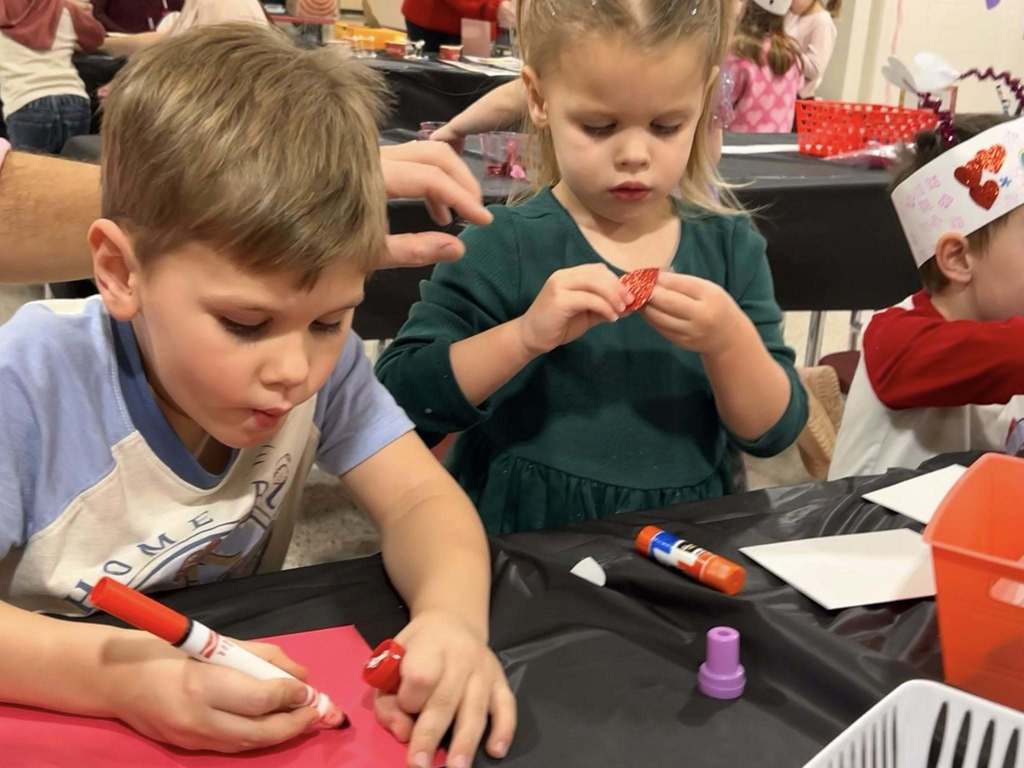 students at sweetheart night making crafts