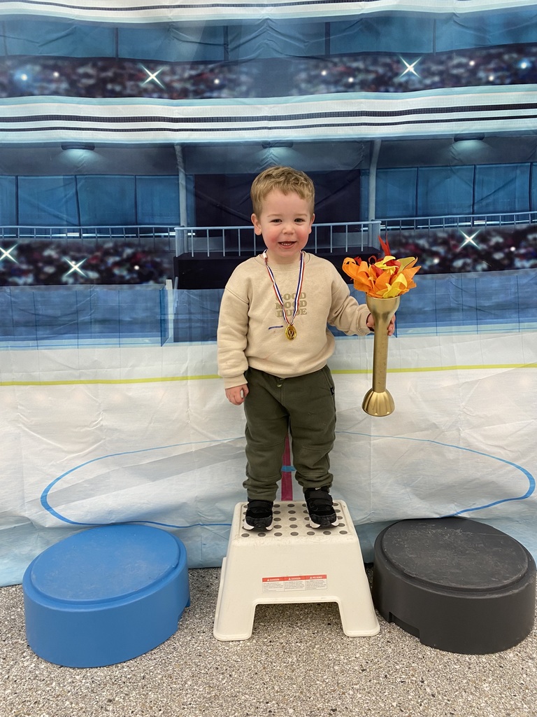 young student holding torch