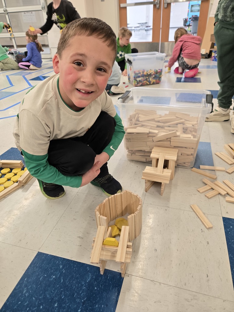 A student building with wooden blocks