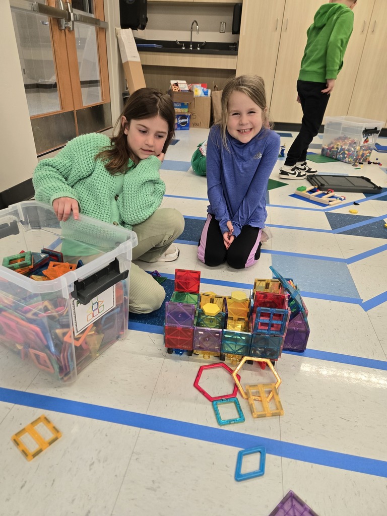 Students showing their magnatile creation 