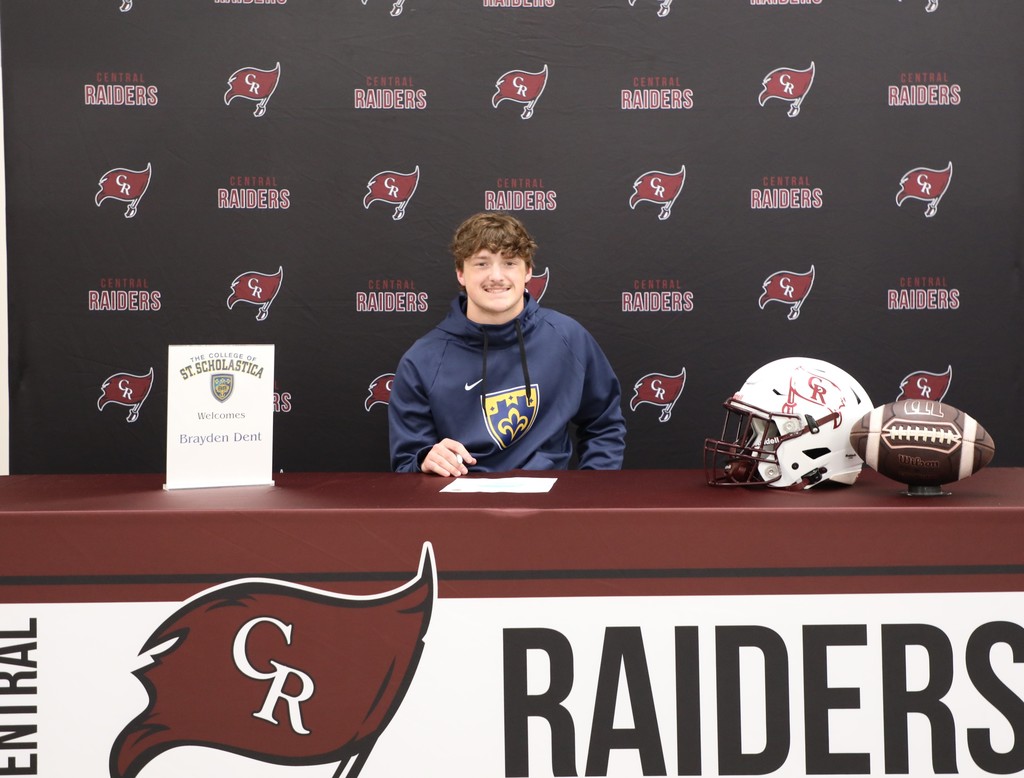 A high school senior after signing a letter to intent to play football in college