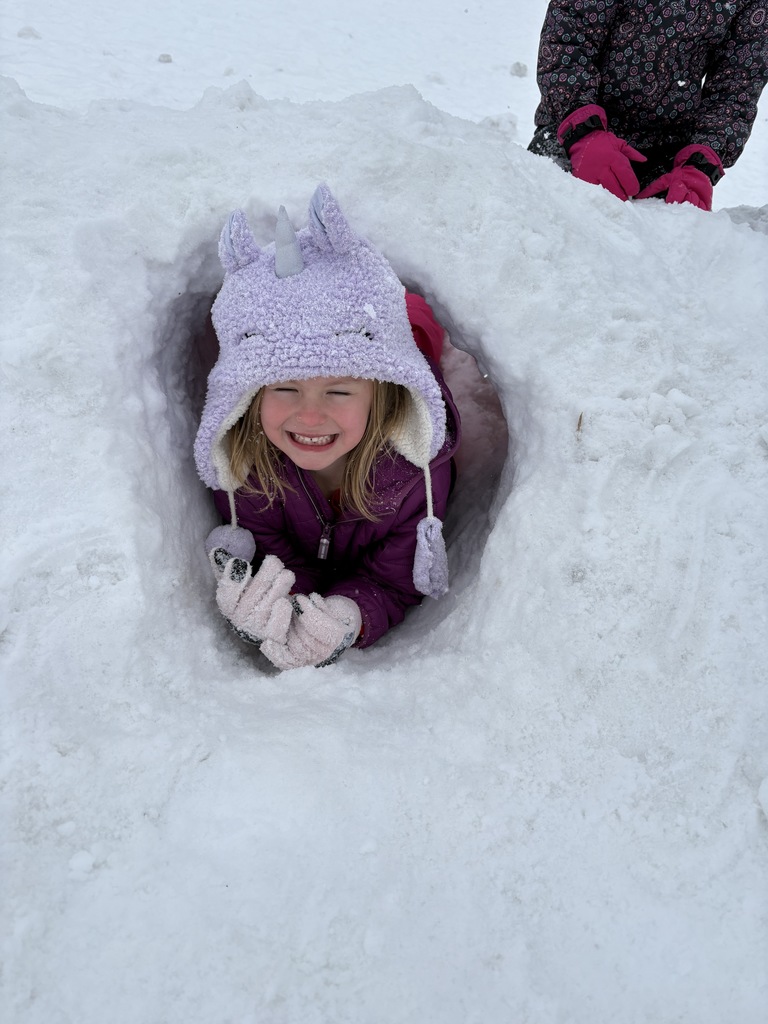 kindergartener playing in the snow