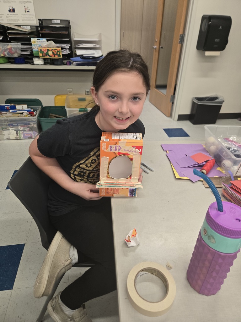 student with handmade birdhouse
