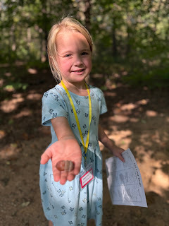 kindergarten student holding acorn