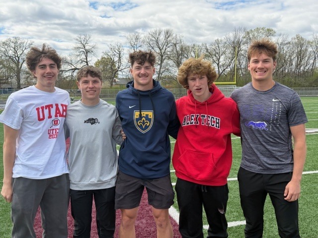 students wearing college shirts on decision day
