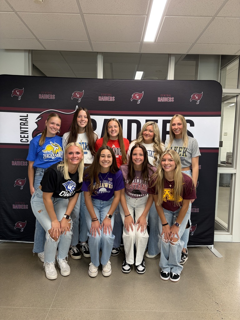 students wearing college shirts on decision day